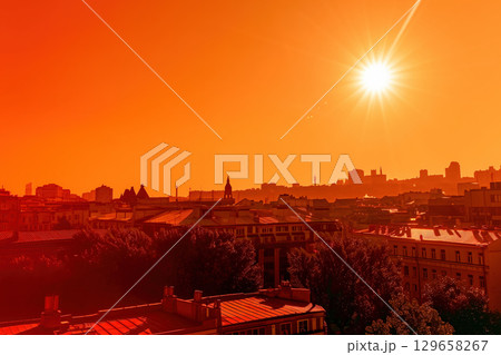 Vibrant cityscape at sunset with glowing skyline Vibrant cityscape at sunset with glowing skyline 129658267