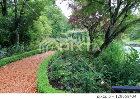 The paths around the lake and gardens of the Lake Garden in the Japanese resort town of Karuizawa in the Nagano Alps. The paths around the lake and gardens of the Lake Garden in the Japanese resort town of Karuizawa in the Nagano Alps. 129658434