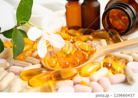 Alternative medicine herbal organic capsule with vitamin E omega 3 fish oil, mineral, drug with herbs leaf natural supplements for healthy good life. 129660437