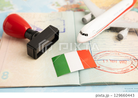 Italy flag and passport with airplane for travel. 129660443