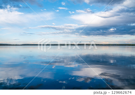 Blue lake with cloudy sky, natural background Blue lake with cloudy sky, natural background 129662674