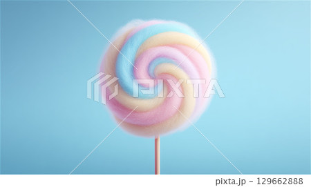 水色の背景に置かれた、渦巻き模様が可愛いパステルカラーの棒付きわたあめの正面 水色の背景に置かれた、渦巻き模様が可愛いパステルカラーの棒付きわたあめの正面 129662888