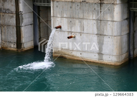 hydroelectric power station water flow mountains. High quality photo hydroelectric power station water flow mountains. High quality photo 129664383