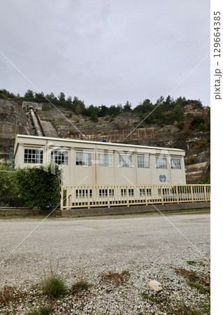 hydroelectric power station water flow mountains. High quality photo 129664385