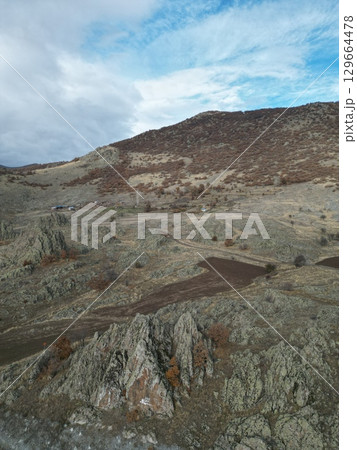 bare rocks nature autumn tree yellow. High quality photo 129664478