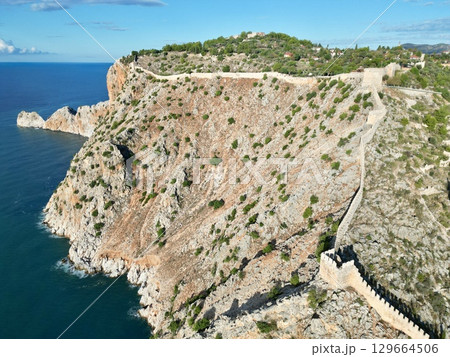 fortress on a rock near the sea coast 129664506