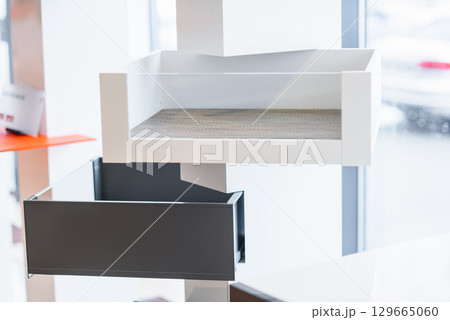 Opened kitchen drawer with cutlery tray. Two drawers are hide behind the high front. Smart storage solution. Opened kitchen drawer with cutlery tray. Two drawers are hide behind the high front. Smart storage solution. 129665060