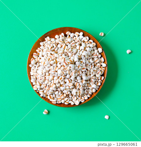 Dried Job's tears or adlay millet in wooden dishes. Dried Job's tears or adlay millet in wooden dishes. 129665061