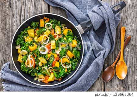 zucchini kale tomato saute sprinkled with sesame 129665364