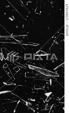 Dirty Glass Broken into a Large Number of Pieces and Parts, a Piece of Glass with a lot of Cracks and Broken Parts. Isolated on Black Background. Dirty Glass Broken into a Large Number of Pieces and Parts, a Piece of Glass with a lot of Cracks and Broken Parts. Isolated on Black Background. 129665624