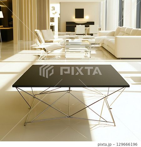 A modern living room with a black coffee table in the center 129666196