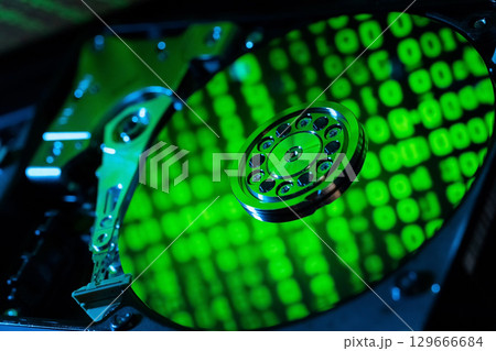 moving hard drive head with green data on drive moving hard drive head with green data on drive 129666684
