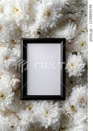 Black funeral frame with white chrysanthemums in a solemn hyper-real tribute scene 129669246