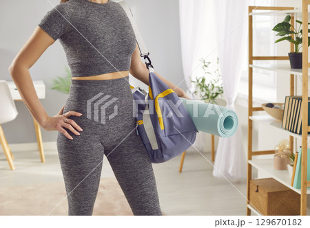 Close-Up Of Female Athlete Abs With Sports Bag For Training Close-Up Of Female Athlete Abs With Sports Bag For Training 129670182