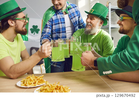Group of happy friends celebrating St. Patrick day together Group of happy friends celebrating St. Patrick day together 129670492