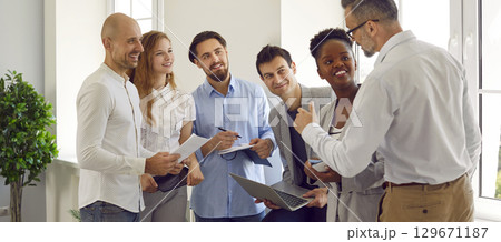 Happy multinational business people are talking at event in the office. Happy multinational business people are talking at event in the office. 129671187