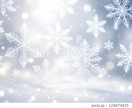 柔らかな光にきらめく白と銀色の雪の結晶が舞う冬の背景イラスト 129674835