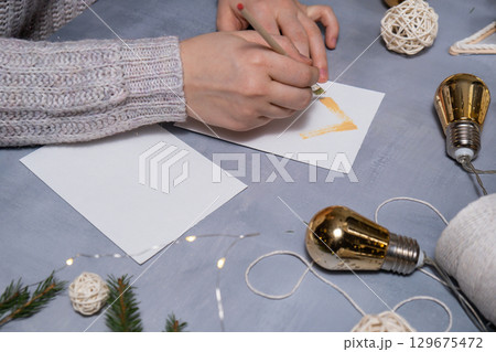 Sustainable Christmas preparation Diy process of making handmade greeting cards. Step by step activity for children. Inclusive and responsible stress relief holiday hobby Sustainable Christmas preparation Diy process of making handmade greeting cards. Step by step activity for children. Inclusive and responsible stress relief holiday hobby 129675472