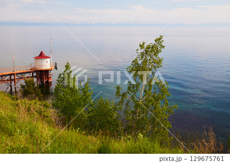 Beautiful summer landscape of Lake Baikal. Listvyanka Village Beautiful summer landscape of Lake Baikal. Listvyanka Village 129675761