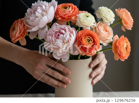 Romantic Ranunculus and Peony Bouquet in Beige Vase 129676256