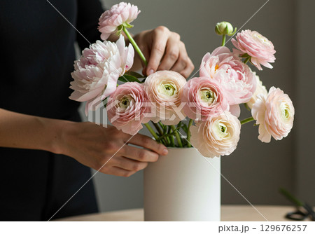 Beautiful Ranunculus and Peony Flowers in White Vase 129676257