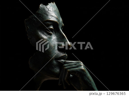 Abstract Bronze Sculpture of a Face in Thought 129676365