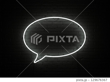 Glowing Neon Speech Bubble on Brick Wall 129676367