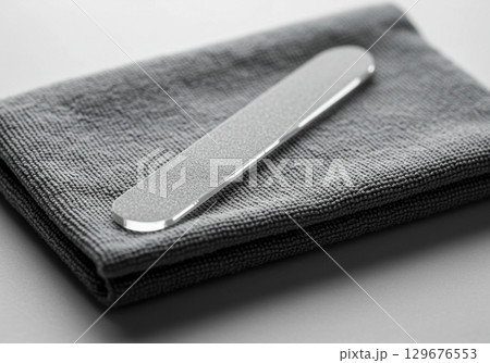 Grey Nail File on Folded Microfiber Cloth Grey Nail File on Folded Microfiber Cloth 129676553