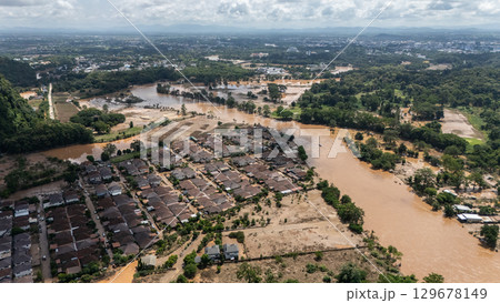 Aerial view of housing estate in suburb of Chiang Rai province flooded by Kok river rising after heavy rain. Chiang Rai hit by flash floods and runoff after overnight rain. Aerial view of housing estate in suburb of Chiang Rai province flooded by Kok river rising after heavy rain. Chiang Rai hit by flash floods and runoff after overnight rain. 129678149