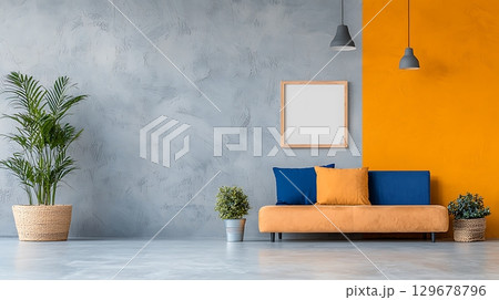 Modern Living Room with Stylish Sofa, Empty Frame, Indoor Plants, and Bright Walls 129678796