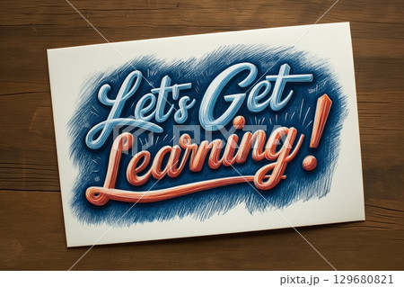 Inspirational hand-lettered design on paper reads "Let's Get Learning " in vibrant blue 129680821