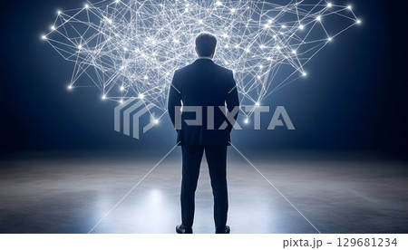 Businessman Contemplates Complex Network of Glowing Connections 129681234