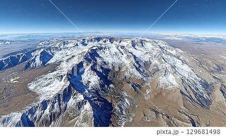 Snow-Capped Mountain Range Under a Clear Blue Sky, Aerial Perspe 129681498