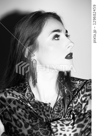 Beautiful woman profile studio portrait Beautiful woman profile studio portrait 129682459