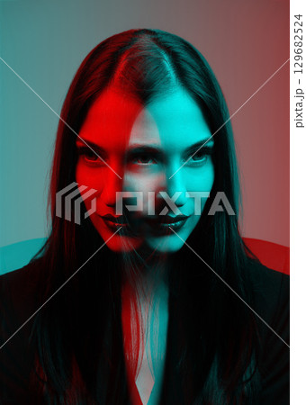 Beautiful woman with dark hair studio portrait in RGB effect style 129682524