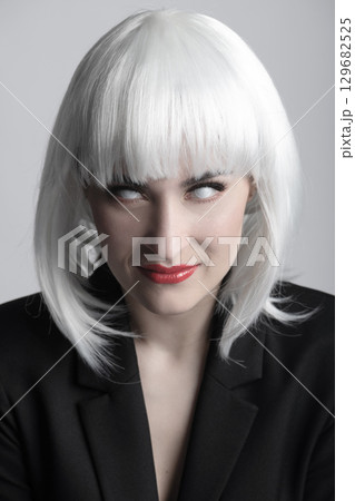 Beautiful woman with white eyes and white wig horror portrait 129682525