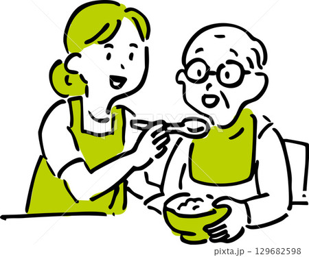 高齢者に食事介助をする介護士 129682598