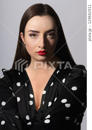Beautiful woman with long dark hair studio portrait Beautiful woman with long dark hair studio portrait 129682911