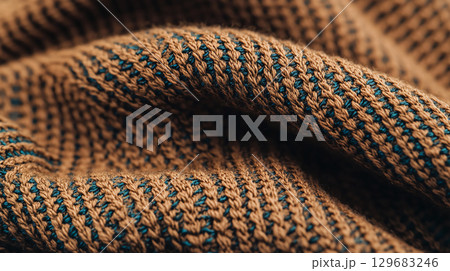 Abstract background Close up of woven fabric featuring intricate patterns in brown and blue. texture showcases rich blend of colors, creating visually appealing design 129683246
