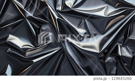 Abstract background Crumpled metallic foil with reflections creating abstract texture. shiny surface showcases intricate folds and highlights, adding depth and visual interest 129683260