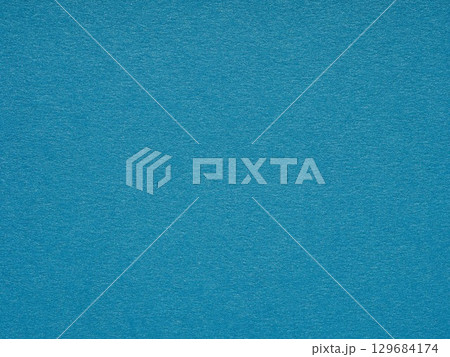 A sea of cerulean serenity, the textured paper exudes a vibrant calmness, echoing the depth of oceanic dreams A sea of cerulean serenity, the textured paper exudes a vibrant calmness, echoing the depth of oceanic dreams 129684174