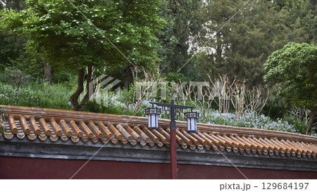 Traditional Chinese lanterns on a tiled roof in Jingshan park in Beijing, China Traditional Chinese lanterns on a tiled roof in Jingshan park in Beijing, China 129684197