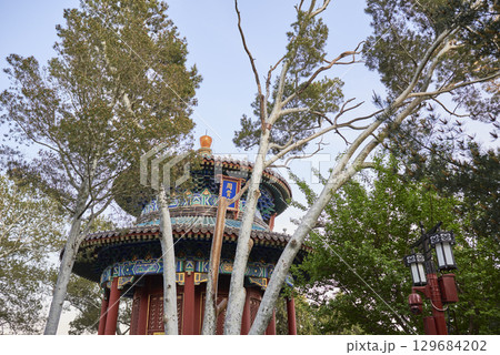 Traditional Chinese pavilion with intricate roof design in Jingshan park in Beijing, China Traditional Chinese pavilion with intricate roof design in Jingshan park in Beijing, China 129684202