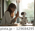 AIロボと笑顔で会話する若い日本人女性 129684295