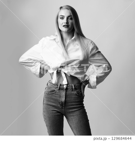 Beautiful long hair woman with classic outfit studio portrait 129684644