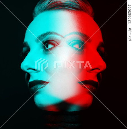 Close-up studio portrait of woman with fancy make-up in RGB color split effect style 129685097