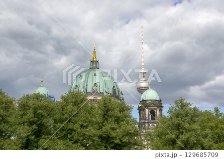 Berlin, Germany - July 01, 2018: View of the dome of the Berlin cathedral and the television tower 129685709