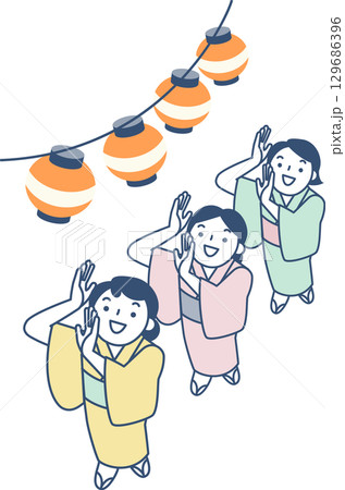 盆踊りで踊る浴衣を着た女性たち 盆踊りで踊る浴衣を着た女性たち 129686396