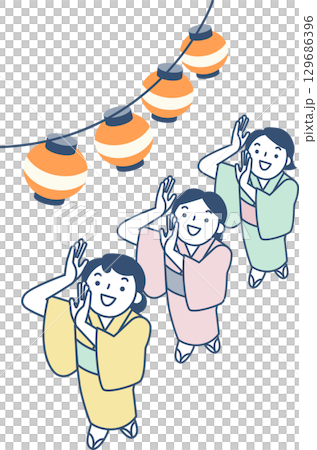 Women in yukata dancing at the Bon Odori festival 129686396