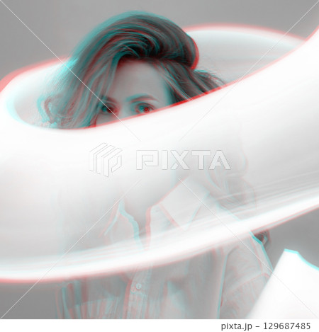 Abstract woman studio portrait with light painting technique in RGB color split effect style 129687485
